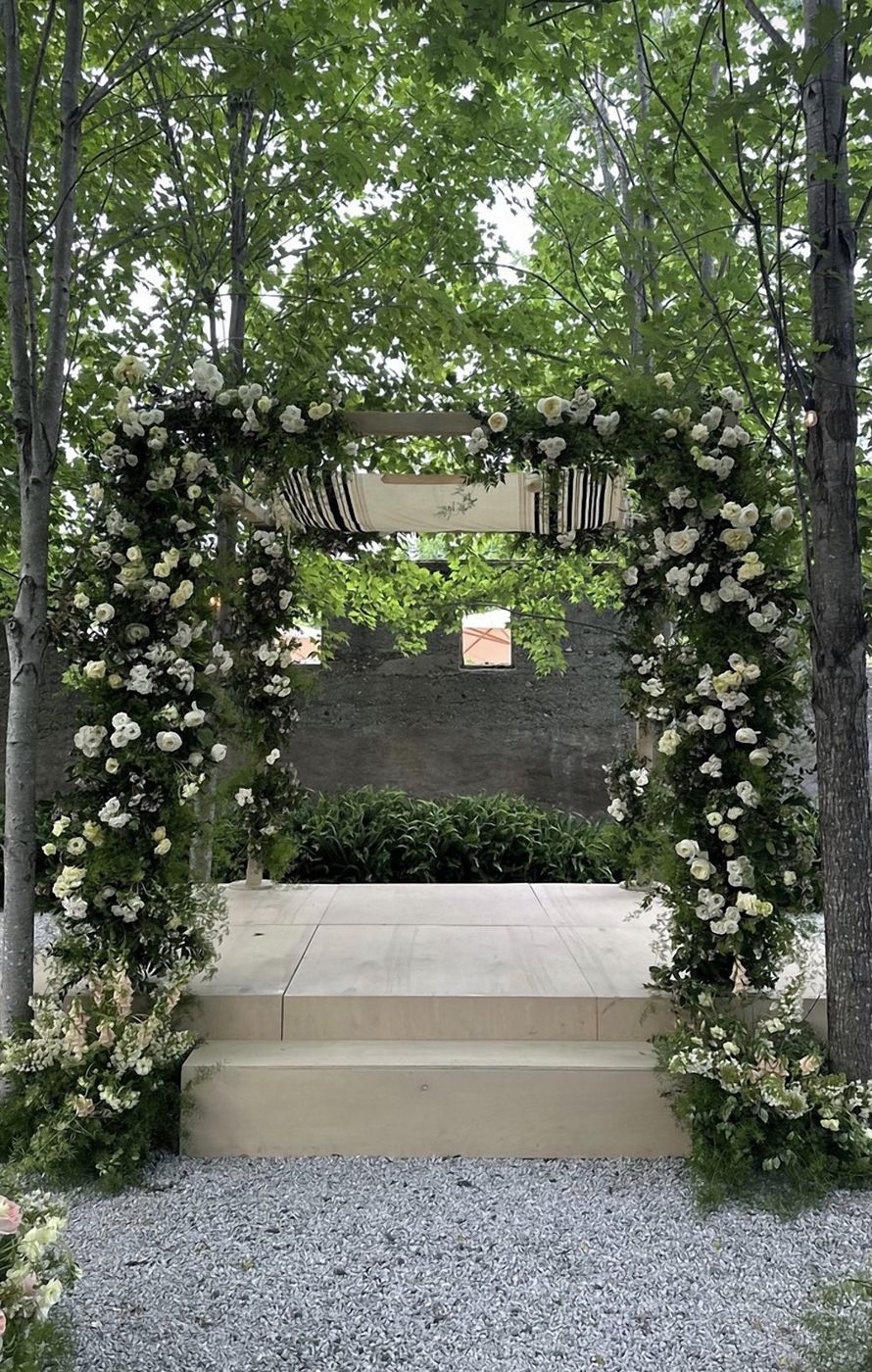 Light wood chuppah + ceremony stage
