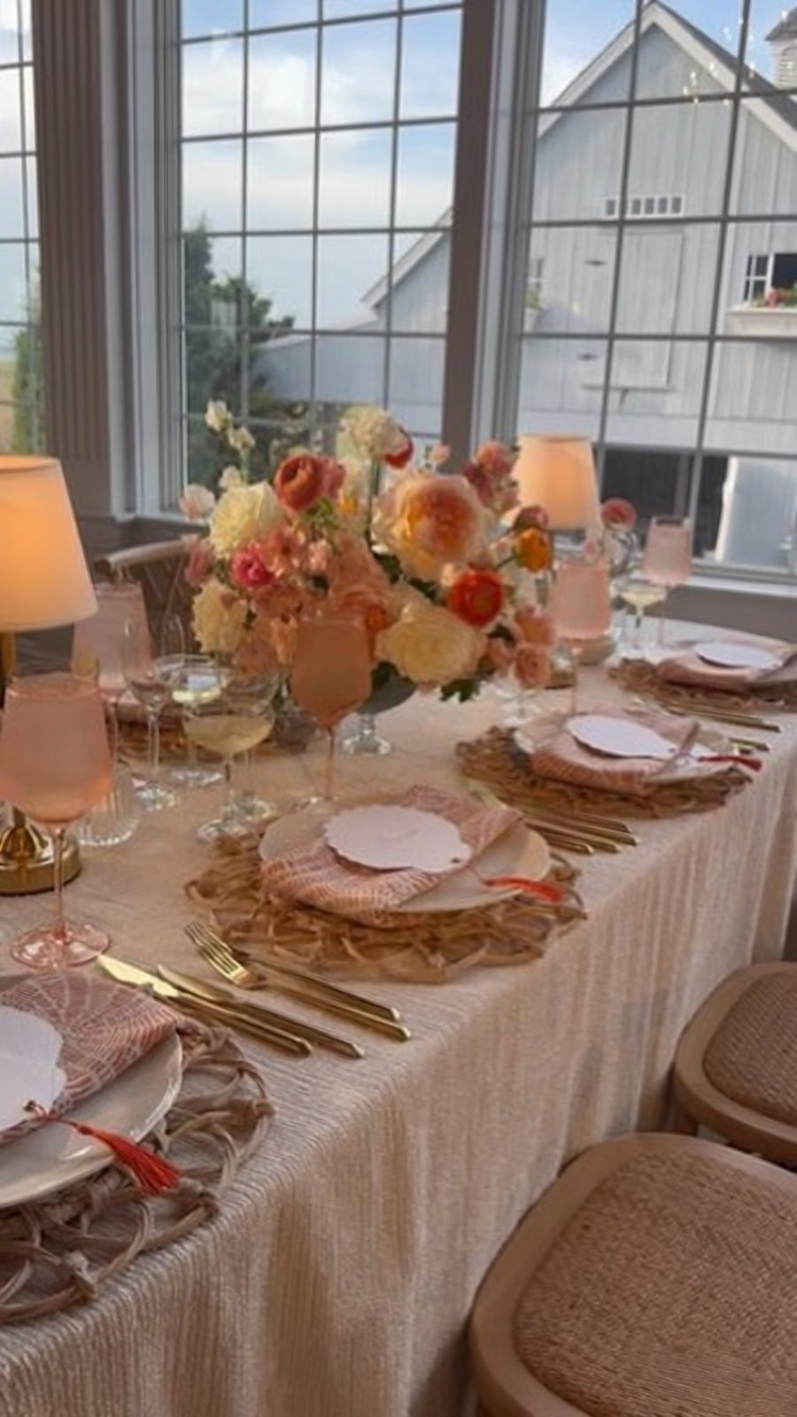 Peach and coral tablescape by the window